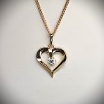 9ct yellow gold open heart pendant and chain necklace with a single 3mm cubic zirconia set to the centre with or without a 16,18, or 20inch 9ct gold curb link chain.