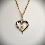 9ct yellow gold open heart pendant and chain necklace with a single 3mm cubic zirconia set to the centre with or without a 16,18, or 20inch 9ct gold curb link chain.