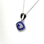 An eye-shaped silver evil eye necklace/pendant made in real sterling silver with sparkling blue & white cubic zirconia with a highly polished finish with a choice of 16, 18 or 20-inch silver chain PCS00131.
