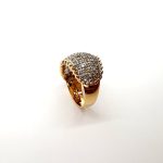 Bombay ring with Seventy round diamonds In a rhodium Pave setting, the total diamond weight is approx. one carat with 7.8 grams of 18ct yellow gold width at the top widest part is 13.6mm tapering to 3.6mm at the back