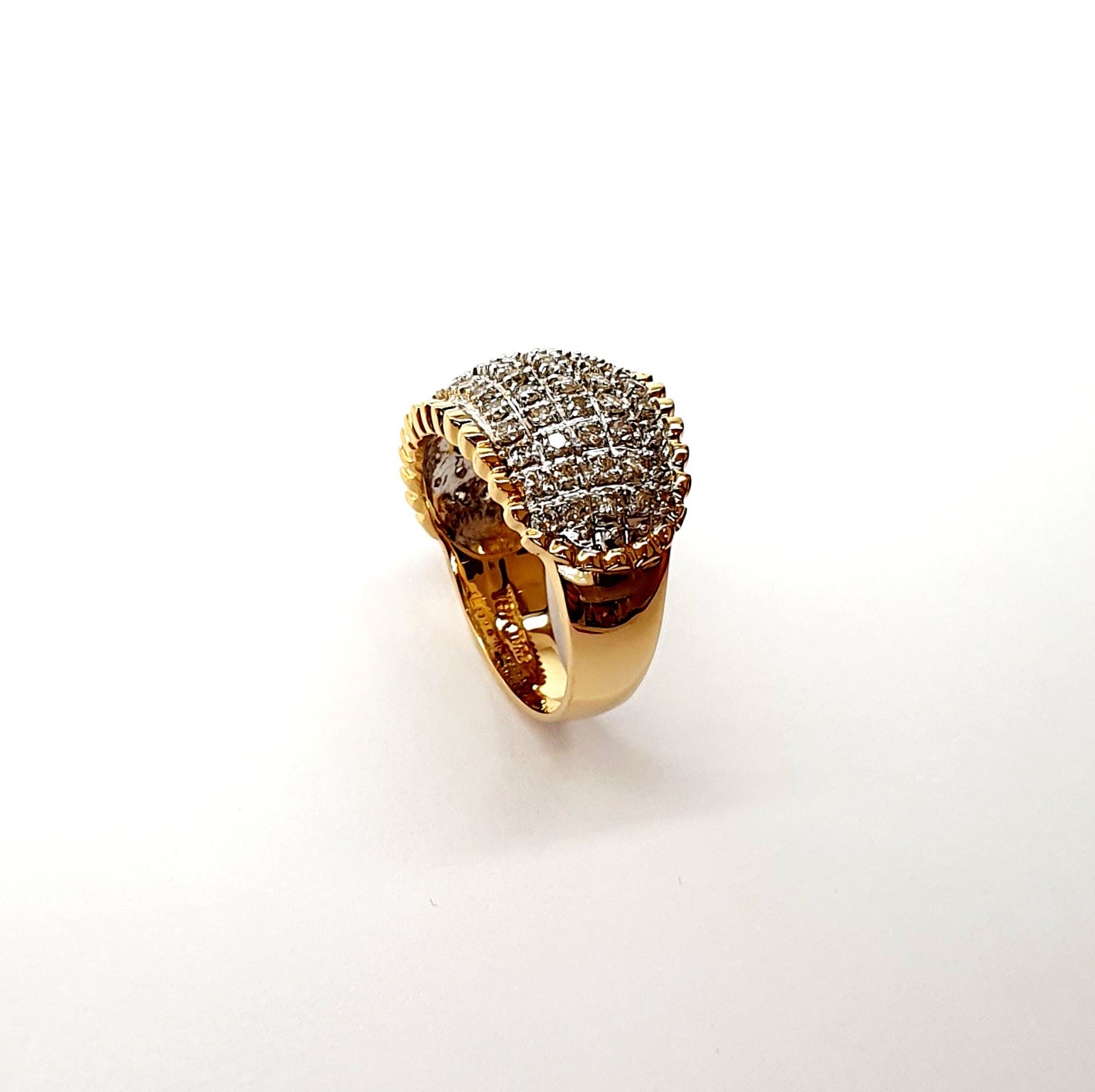 Bombay ring with Seventy round diamonds In a rhodium Pave setting, the total diamond weight is approx. one carat with 7.8 grams of 18ct yellow gold width at the top widest part is 13.6mm tapering to 3.6mm at the back