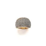 Bombay ring with Seventy round diamonds In a rhodium Pave setting, the total diamond weight is approx. one carat with 7.8 grams of 18ct yellow gold width at the top widest part is 13.6mm tapering to 3.6mm at the back