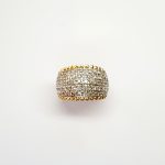 Bombay ring with Seventy round diamonds In a rhodium Pave setting, the total diamond weight is approx. one carat with 7.8 grams of 18ct yellow gold width at the top widest part is 13.6mm tapering to 3.6mm at the back