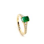 Side view of emerald-cut ring showing diamond accents