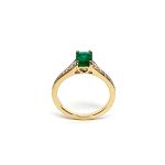 18ct Yellow Gold Emerald Cut Emerald Ring RA00694 with Diamond Tapered Shank to Each Side.