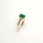 18ct Yellow Gold Emerald Cut Emerald Ring with Diamond Tapered Shank to Each Side.