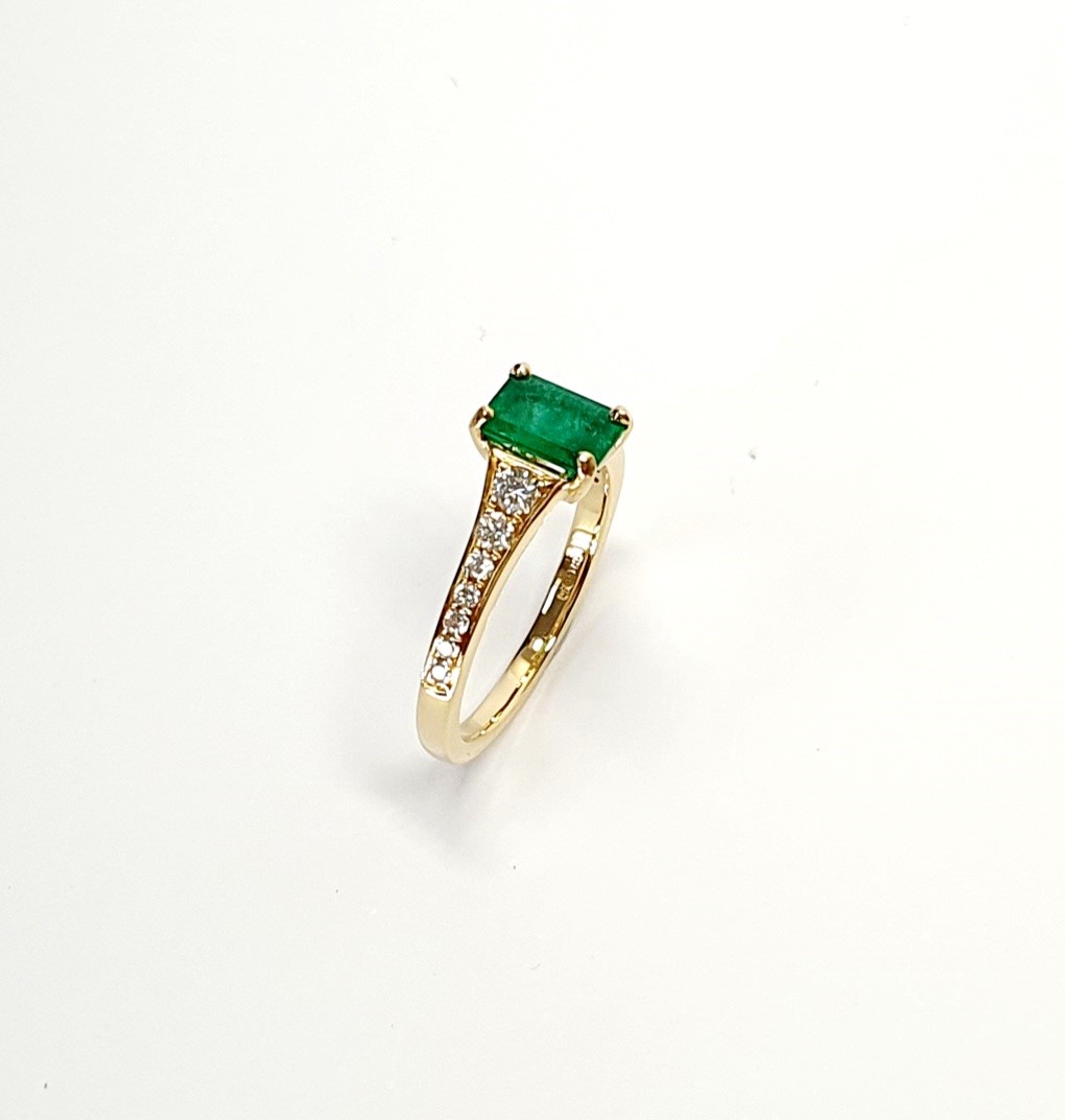 18ct Yellow Gold Emerald Cut Emerald Ring with Diamond Tapered Shank to Each Side.