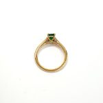 Under-gallery detail of emerald and diamond ring