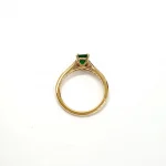 Under-gallery detail of emerald and diamond ring