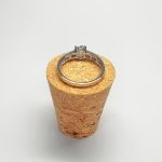 The Lambeth Platinum Diamond Engagement Ring RPT00045 The centre is set with a 0.70ct round brilliant-cut diamond of Colour H clarity SI1, which has an excellent cut, proportions, and symmetry. The side shoulders are channel set with a total of four princess-cut diamonds and four baguette-cut diamonds. The total diamond weight is 1.08 carats.