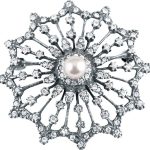 A real sterling silver starburst brooch with a single cultured pearl centre radiating a starburst of white sparkling crystals and an outer scalloped edge, BRS00098.measures 38mm x 38mm.