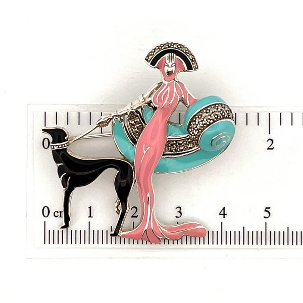 The City of London Jewellers presents the Ru Paul's Drag Race Lady & Dog Brooch Art Deco style designed in sterling silver with pink sky blue & black enamel encrusted with marcasite stones BRS00100.