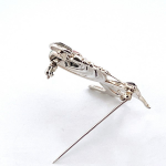 The City of London Jewellers presents the Ru Paul's Drag Race Lady & Dog Brooch Art Deco style designed in sterling silver with pink sky blue & black enamel encrusted with marcasite stones BRS00100.showing back pin.