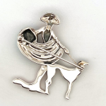 The City of London Jewellers presents the Ru Paul's Drag Race Lady & Dog Brooch Art Deco style designed in sterling silver with pink sky blue & black enamel encrusted with marcasite stones BRS00100.Showing back.