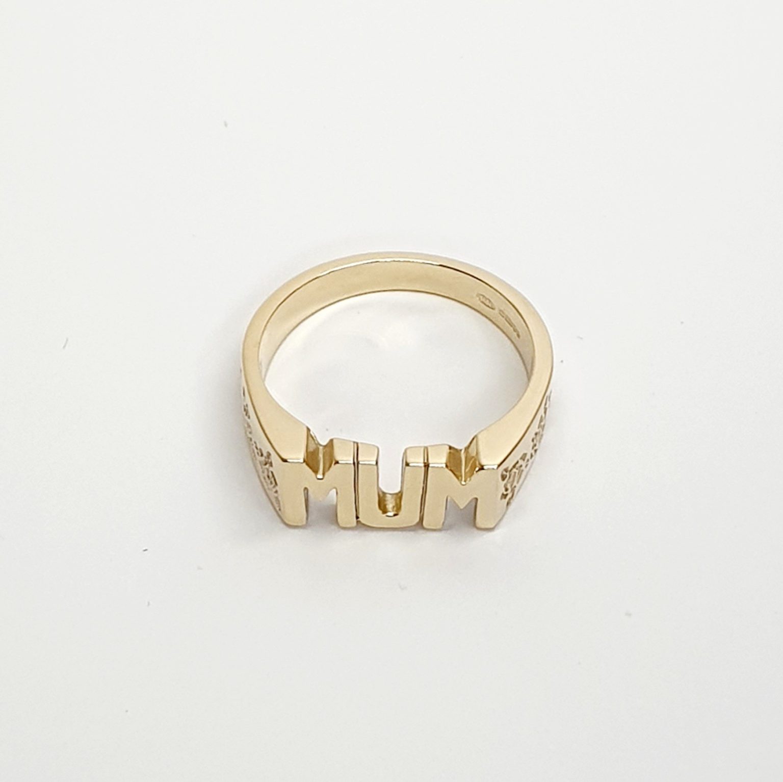 The solid 9ct yellow gold mum ring R00145 has three hand-engraved roses on each side.