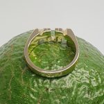 The solid 9ct yellow gold mum ring R00145 has three hand-engraved roses on each side.