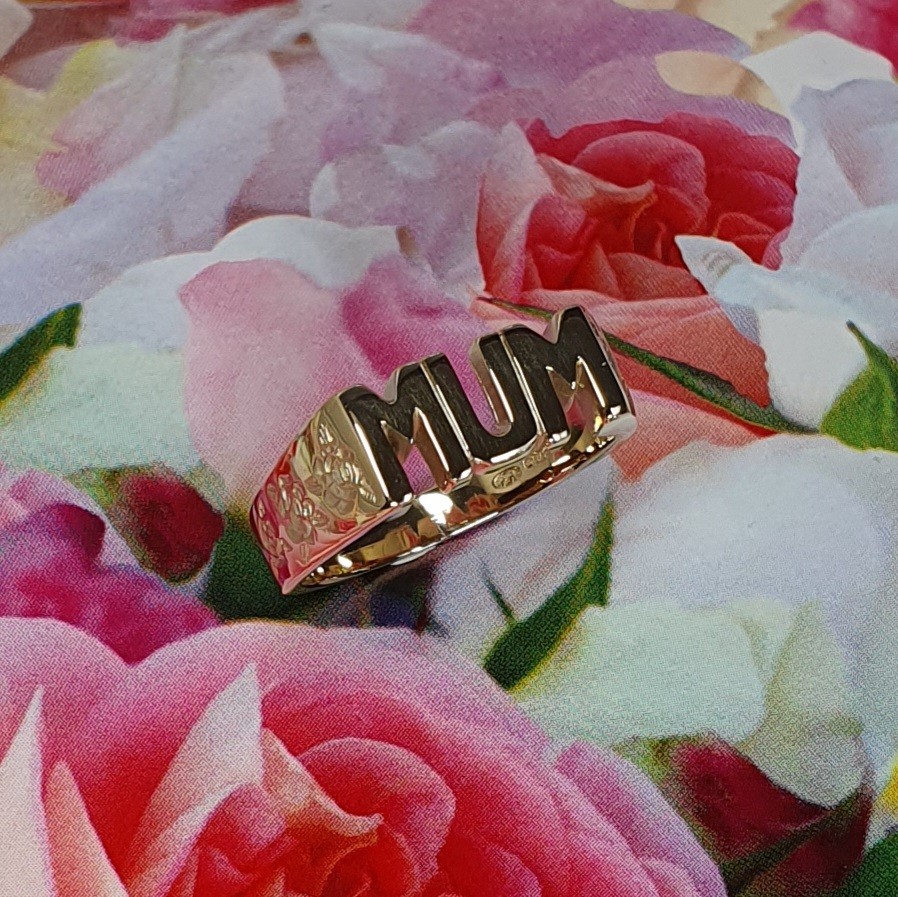 The solid 9ct yellow gold mum ring R00145 has three hand-engraved roses on each side.
