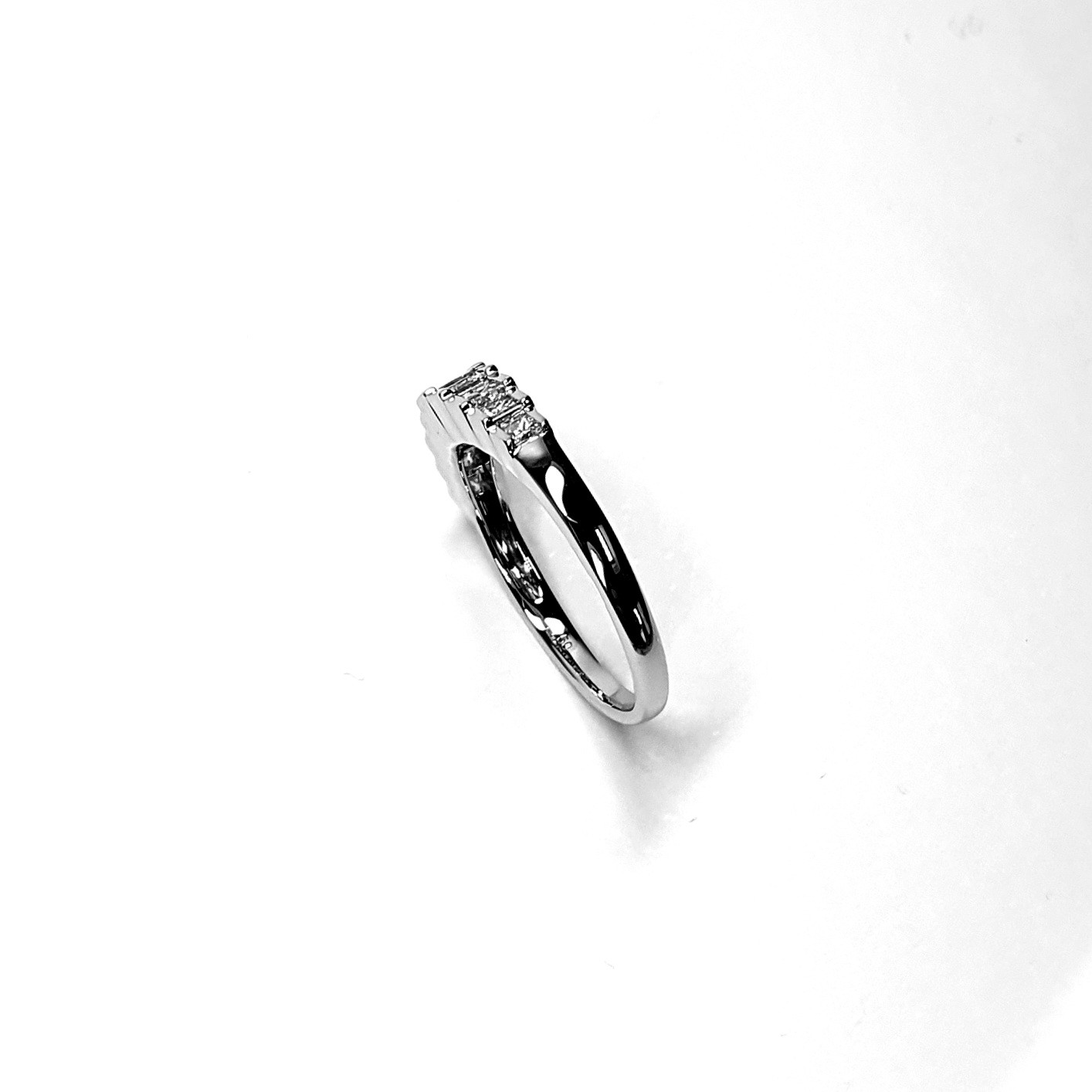 Art Deco style eternity ring crafted in 18ct white gold & set with nine graduated square princess cut diamonds in graduating square box style settings RA00697.