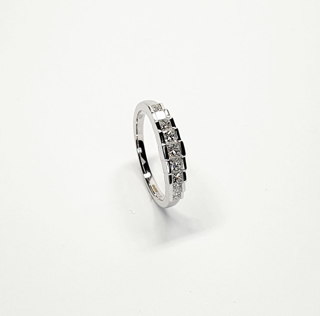 Art Deco style eternity ring crafted in 18ct white gold & set with nine graduated square princess cut diamonds in graduating square box style settings RA00697.