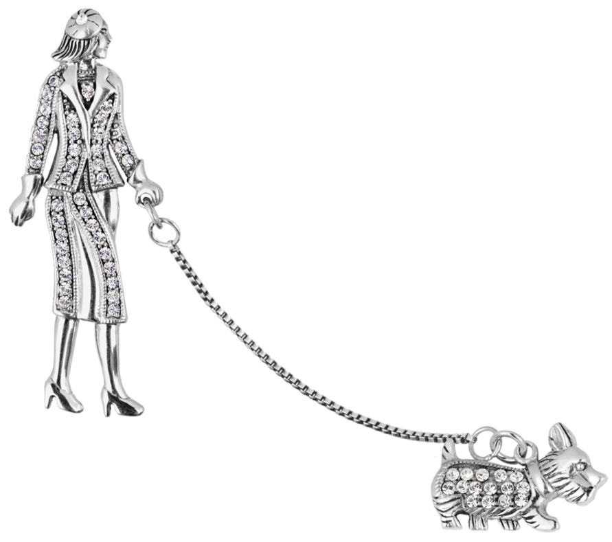 A real silver lady walking a dog on a chain leash brooch set with cubic zirconia with two pins.