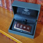 Douglas Pell clip for your cash Pictured in the box on a bookshelf.