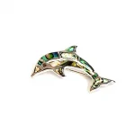 Oyster shell dolphin brooch in sterling silver. Front view close up.