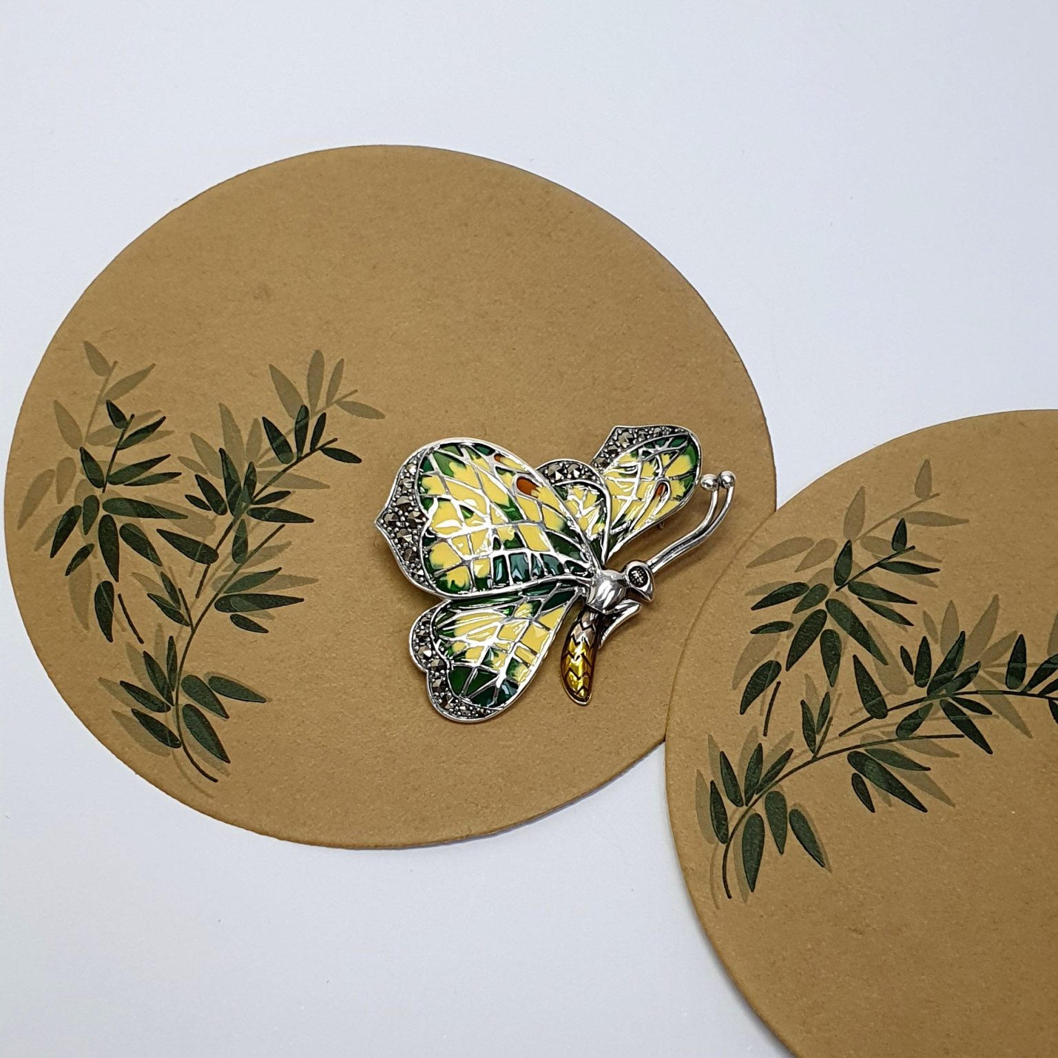 Genuine 925 sterling silver butterfly brooch with lemon and pale green colour Plique-à-jour enamel wings with real marcasite set to the tips, the body and eye with a golden yellow enamel with two long polished silver antennae