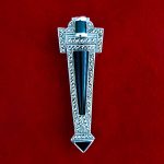 Art Deco style Brooch pin set with Black Onyx, Green Agate and Marcasite BRS00106. Front view on red background.