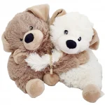 Gold expanding baby bangle 5mm wide with a diamond cut pattern BBG0003 shown in between two cuddling toy teddy bears
