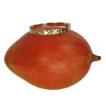 Childs bangle with a diamond cut pattern shown on top of a mango