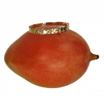 Childs bangle with a diamond cut pattern shown on top of a mango