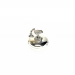 Hallmarked Silver round-hinged pill box with a 3D stork and a baby standing on the lid facing to the left view from the top.