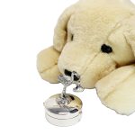 Round-hinged trinket box with a 3D stork standing on the lid facing to the right .