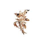 9ct rose gold flower brooch with five leaves, two round purple amethyst stones and three pearls made into a bouquet and tied to the bottom with a small twisted gold bow. Back view.