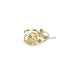 9ct yellow gold brooch with a sprig of seven leaves coming through a floral swirl of polished and barked yellow gold with three bright green emeralds & three sparkling diamonds set into a small white rhodium section, top view.