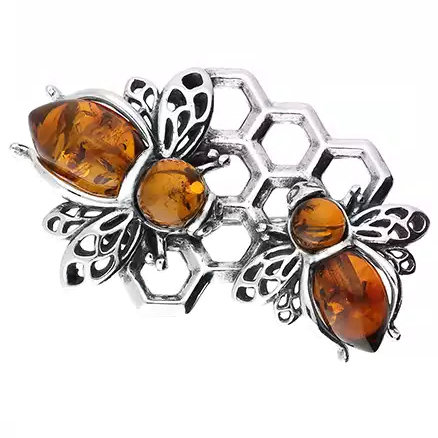 Genuine silver honey bees on a honeycomb brooch pin with natural cognac Baltic amber embellishments.