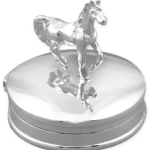 A petite round polished silver trinket box with a cantering horse on the top of the hinged lid.
