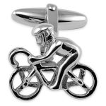 A striking pair of sterling silver cufflinks a carved racing cyclist on a bike with a helmet.