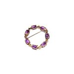 Seven round, beautiful cultured pearls with a further seven alternating stunning oval amethyst gemstones all set into a 9ct yellow gold circle wreath design brooch. View from the back.