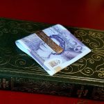 Exquisite gold money clip with a polished back and barked detail to the front.