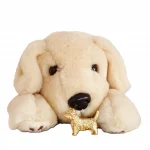 Picture of a 9ct Gold West Highland Terrier Brooch BR00058 with a cuddly toy dog.