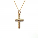 9ct gold cross pendant with hand-engraved tree bark texture.