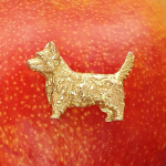 Westie Sottish dog brooch pictured on a mango.