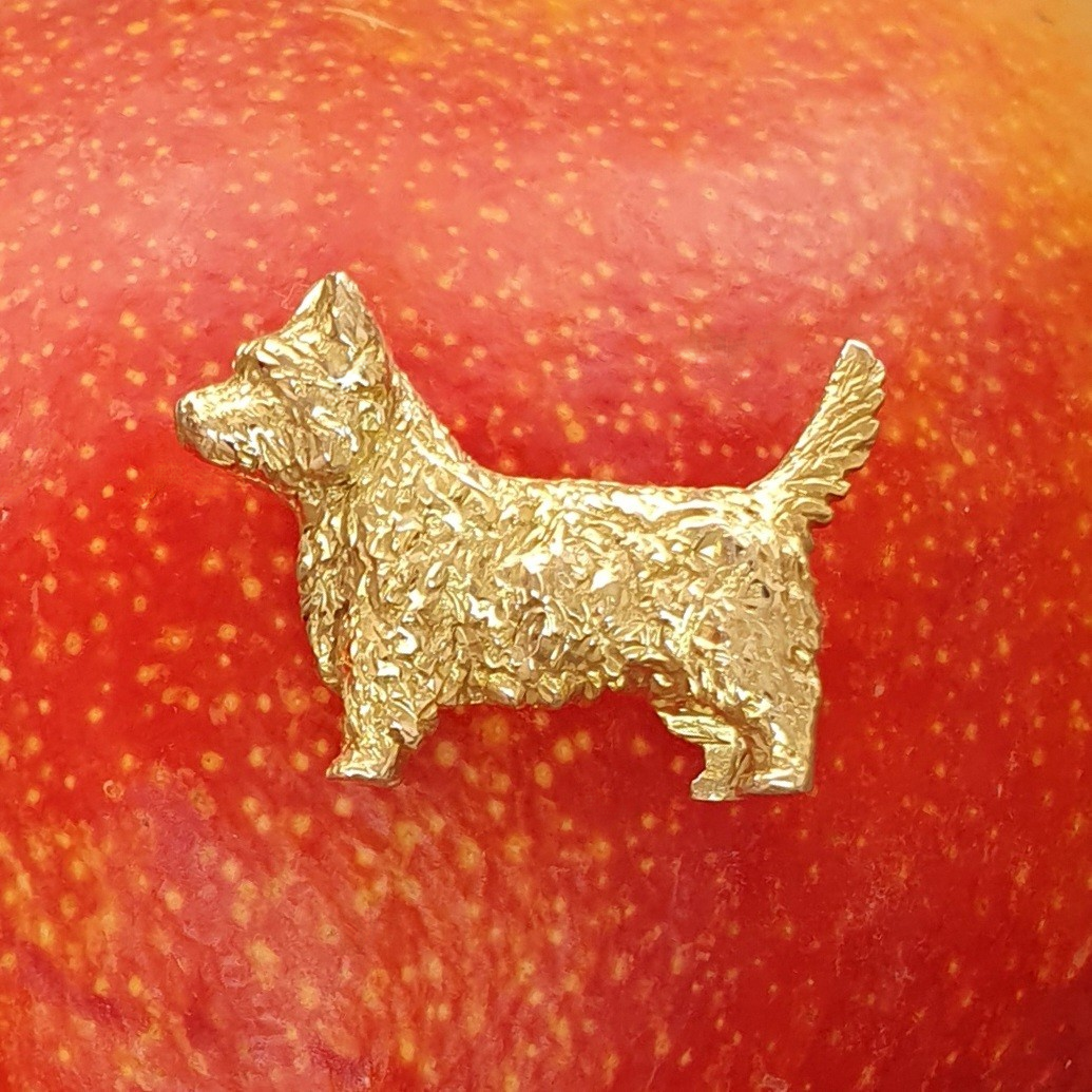 Westie Sottish dog brooch pictured on a mango.