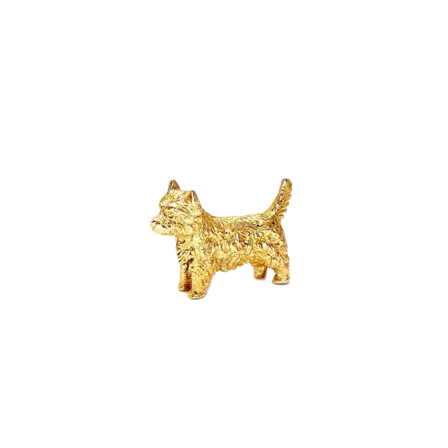 Westie dog brooch crafted in yellow gold.