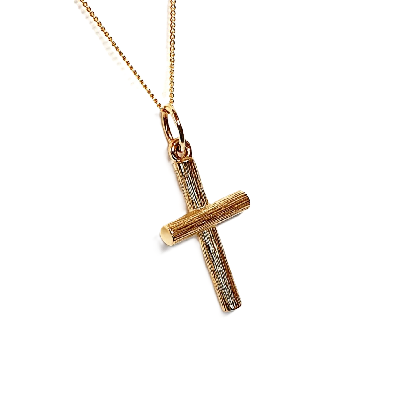 9ct gold solid log cross necklace engraved with bark pattern, viewed at a left tilt.