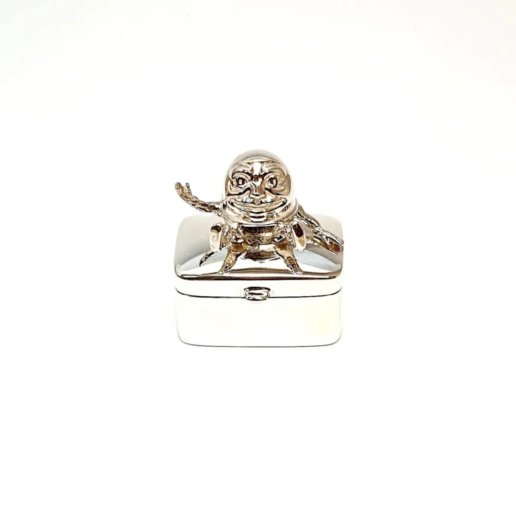 Real silver Humpty Dumpty pill box pictured closed.