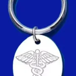 Close up picture of a genuine silver medical alert key ring fob on blue background.