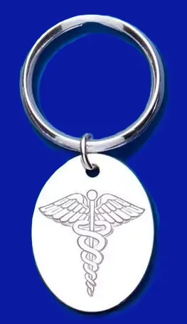 Close up picture of a genuine silver medical alert key ring fob on blue background.