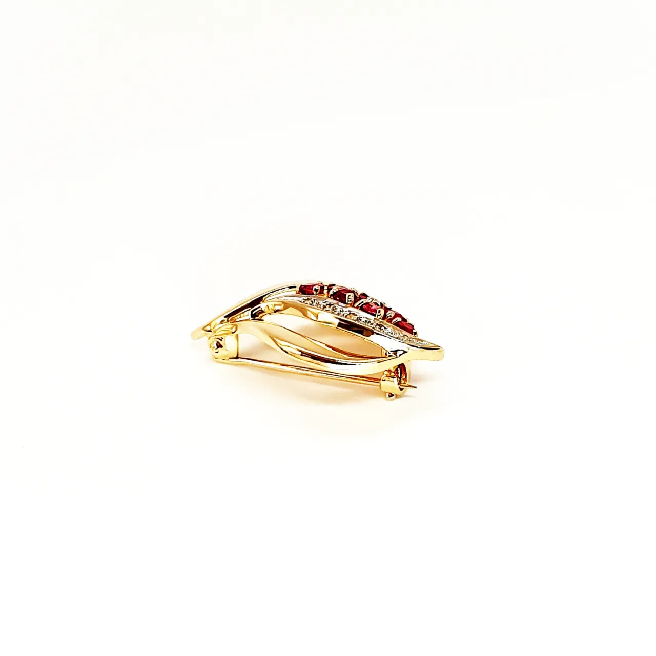 Yellow and white gold brooch with diamonds and rubies side view.